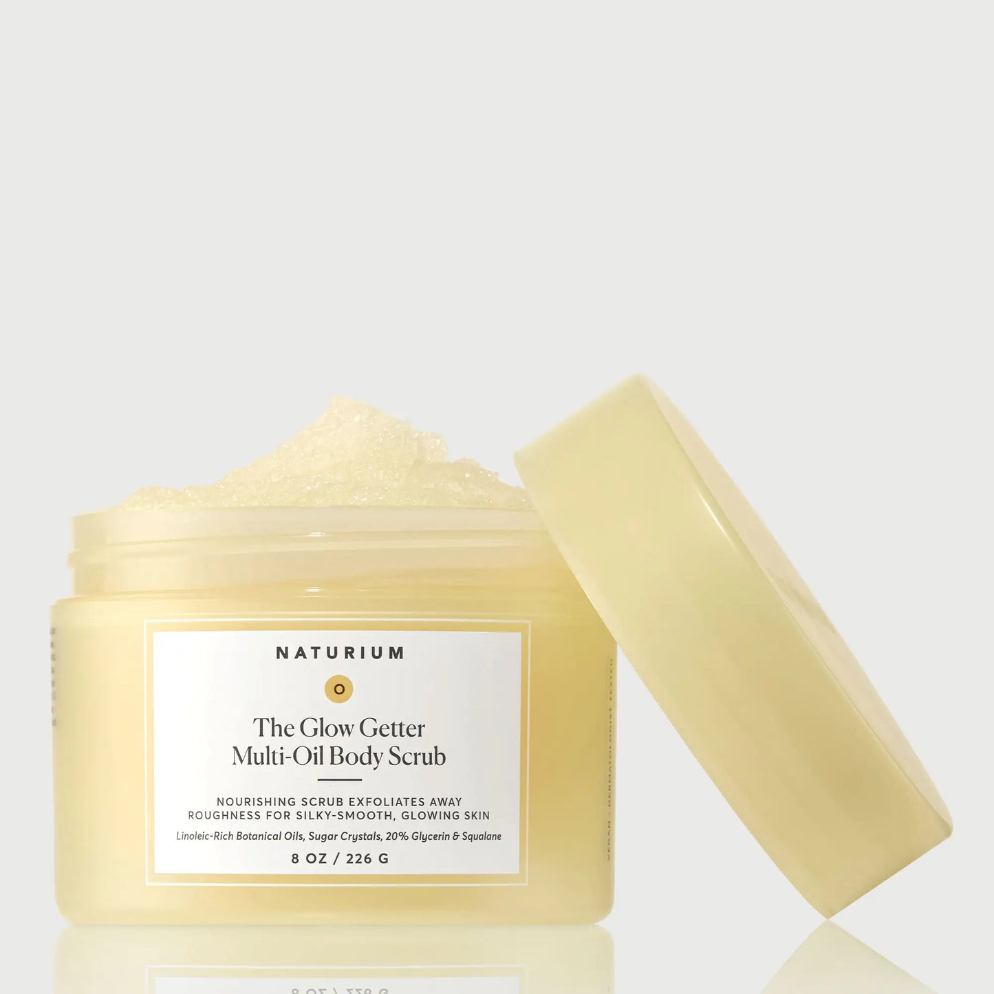 the-glow-getter-multi-oil-body-scrub-c8 NATR-40028-GlowGetter-Multi-Oil-Body-Scrub-Front-CapOff-bonebkgd.webp