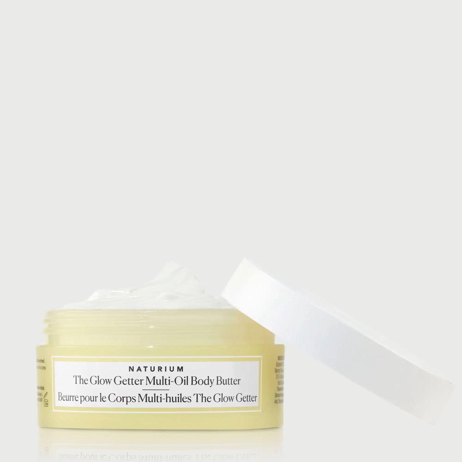 the-glow-getter-multi-oil-body-butter-travel-size-a4 NATR-40115_Glow-Getter-Body-Butter-Mini_front_capoff_bonebkgd.webp